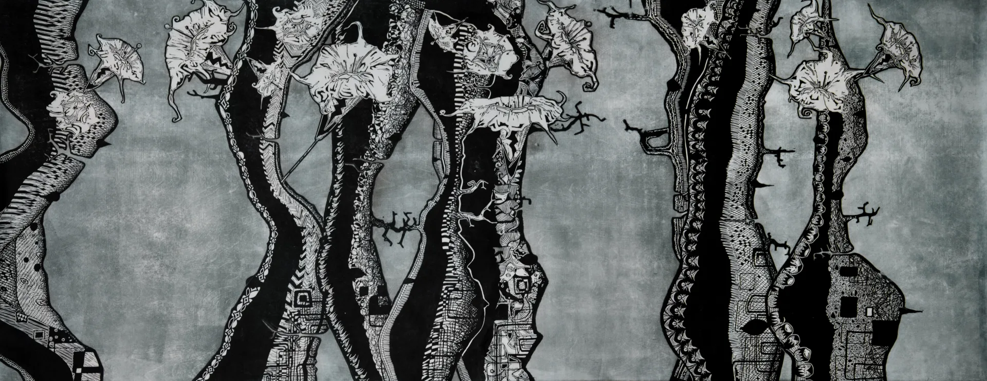 A panoramic blue-gray woodcut grove of root-like trunks, leaves, and small dwelling forms.