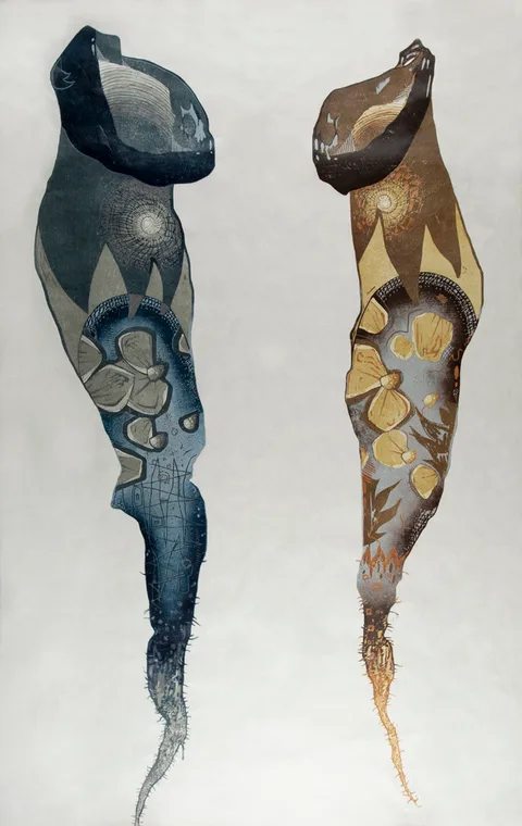Twin chrysalis figures, indigo-slate and ochre-gold, on bone paper — woodcut by Abraham McCowan.